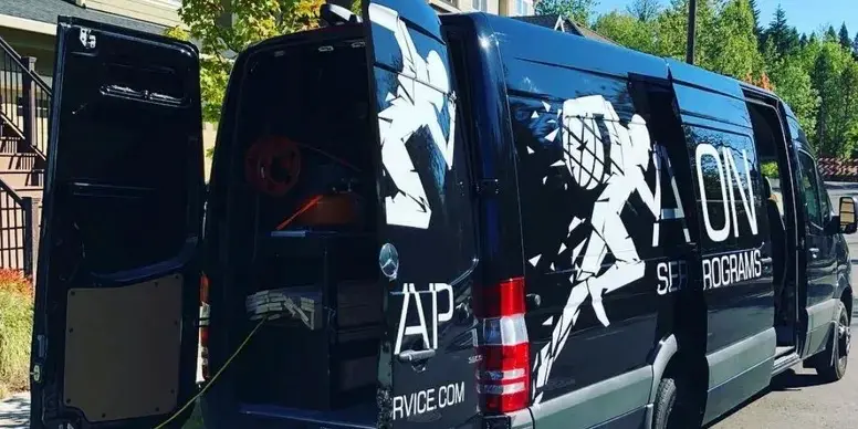 Action Services and Programs van at a project.