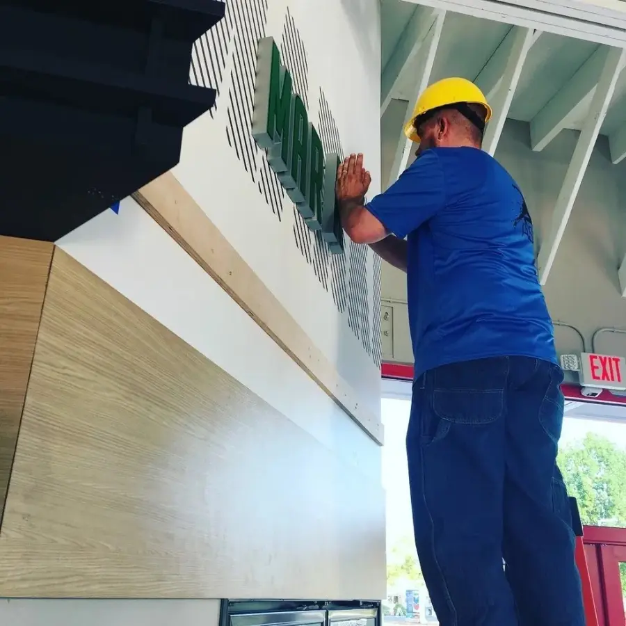 Dimensional signage installation by Action Services & Programs