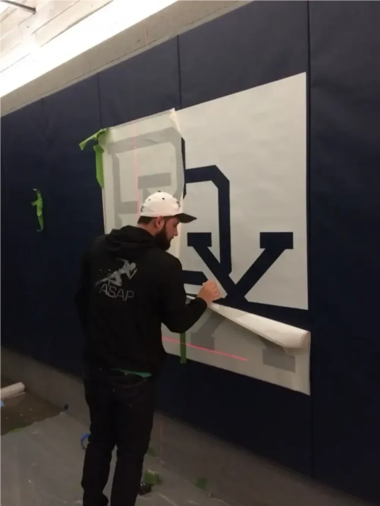 Wall graphic installation for branded commercial environment