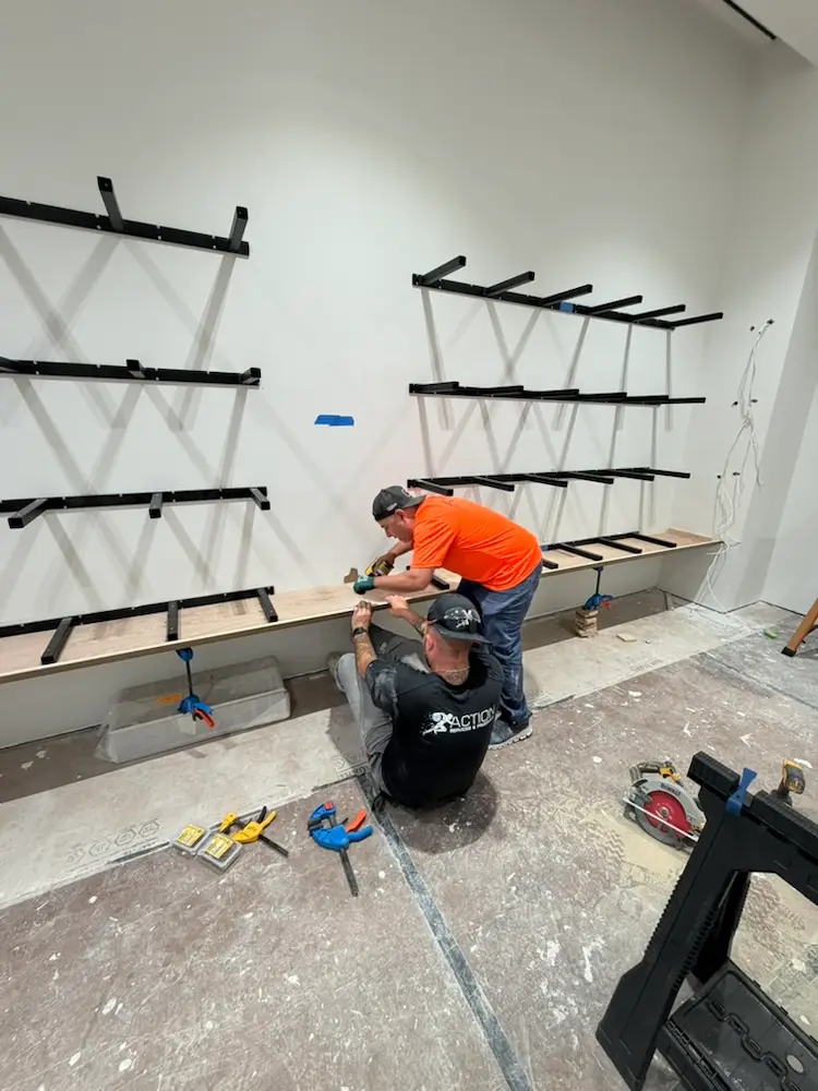 Professional Action Services' installers assembling retail shelving and fixtures